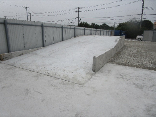 Sakura Industrial Yard — sloped concrete access ramp