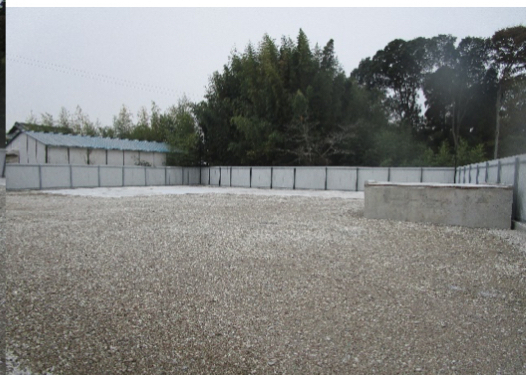 Sakura Industrial Yard — open gravel yard beside trees
