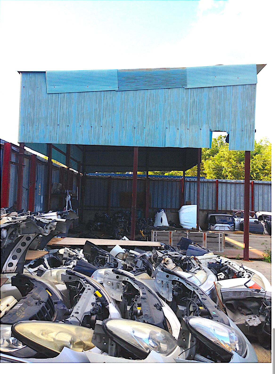 Yotsukaido Industrial Yard — dismantled vehicle parts stacked beside the loading area