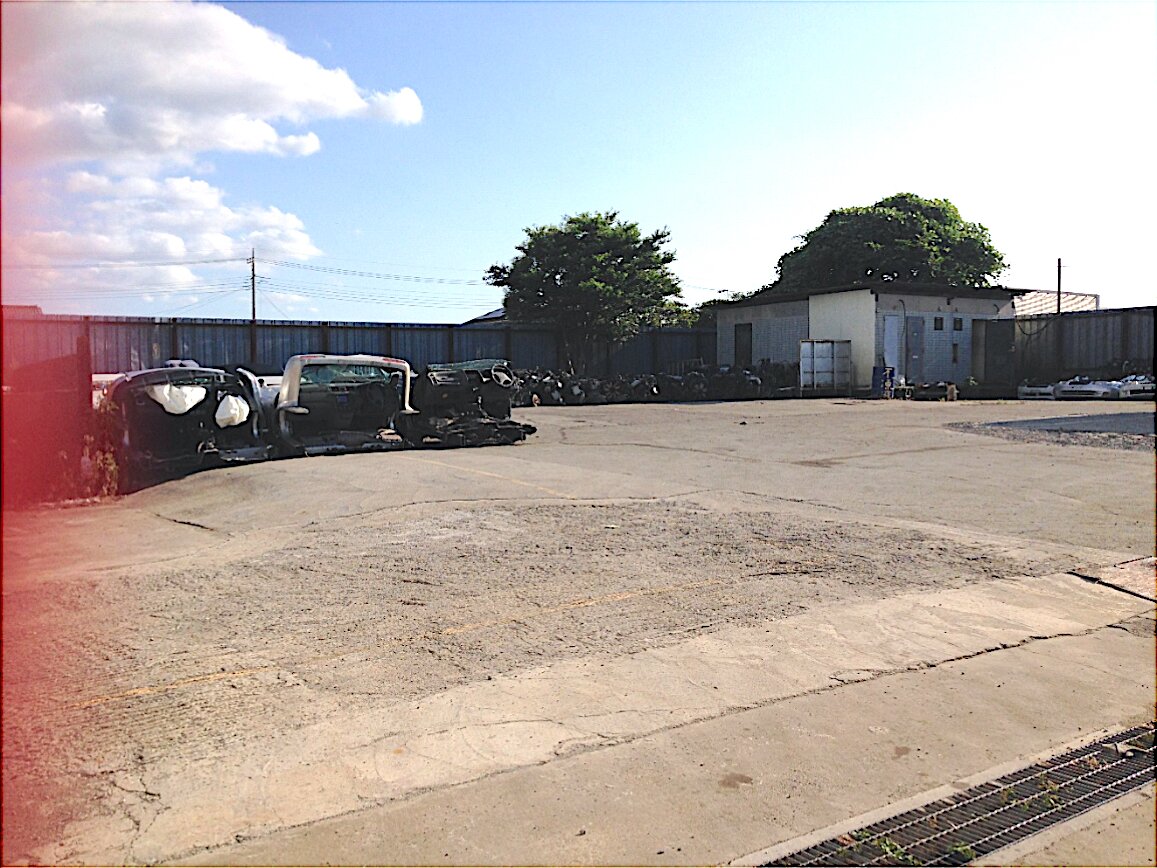 Yotsukaido Industrial Yard — open work yard beside the workshop