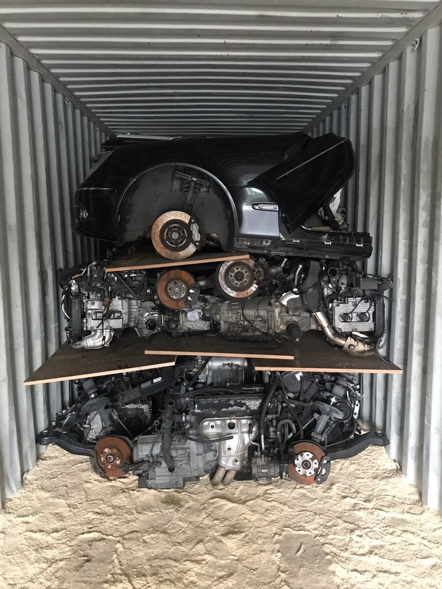 Dark vehicle front section above two tiers of engines