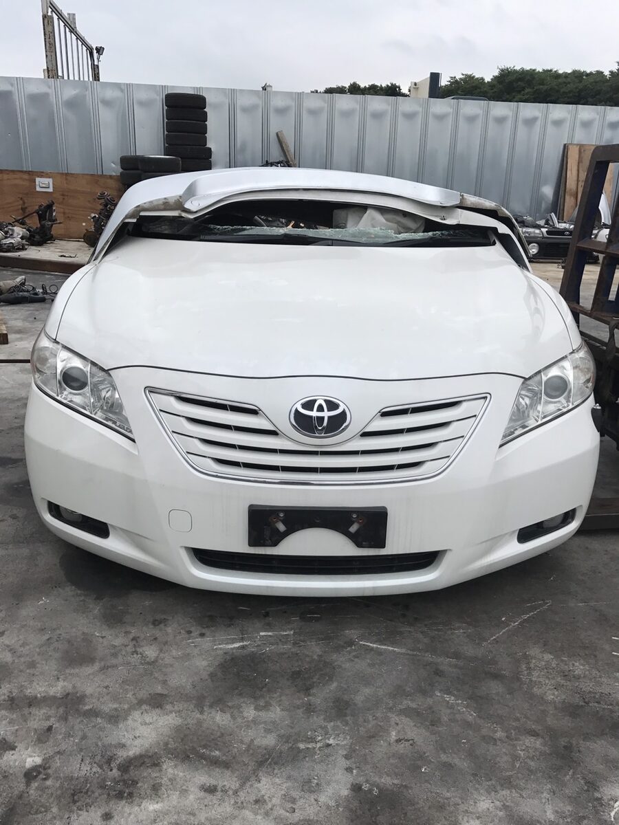 White sedan parked outdoors