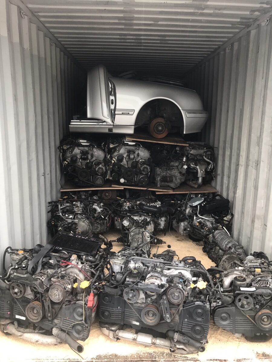 White vehicle body section above several tiers of engines