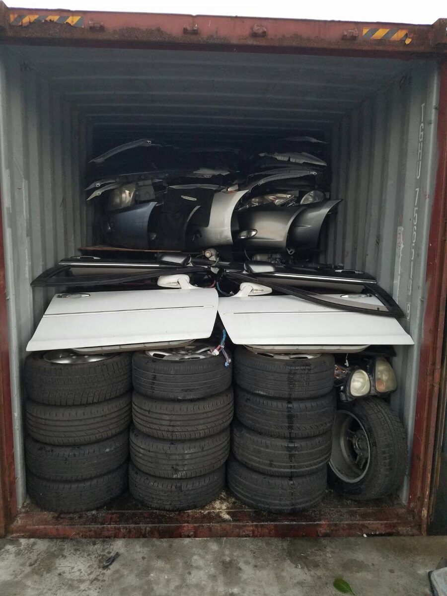 Used tires and parts packed inside a shipping container