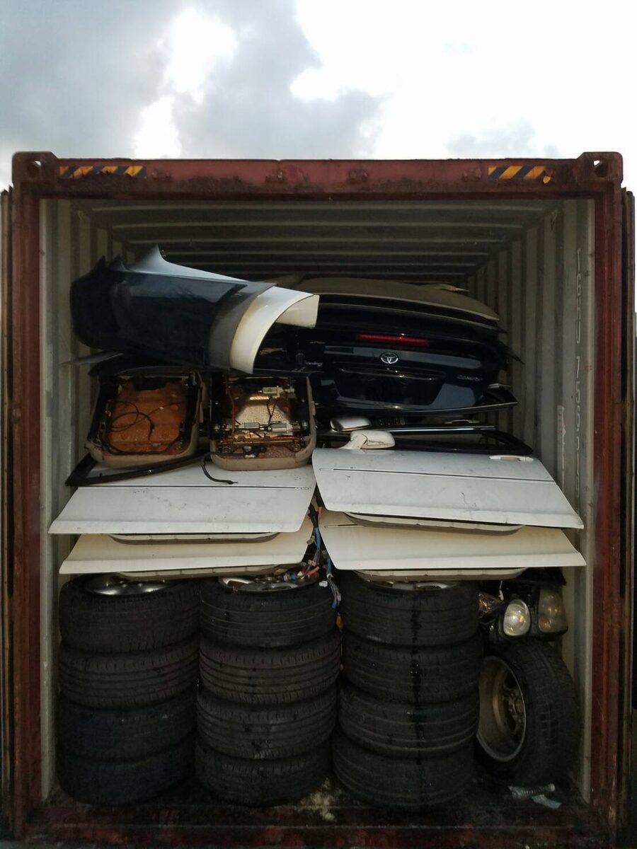 Used tires and parts inside a shipping container