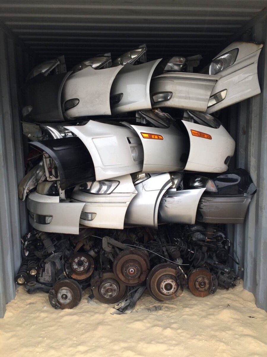 Used tires and body parts packed in a shipping container