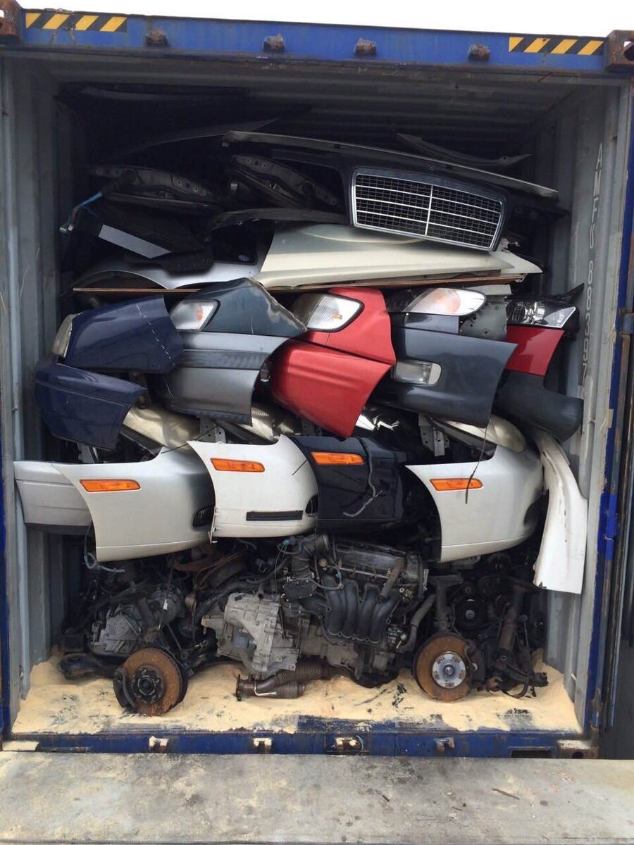 Used tires and body panels packed in a shipping container