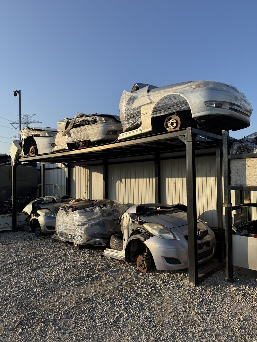 Used vehicles stacked for storage