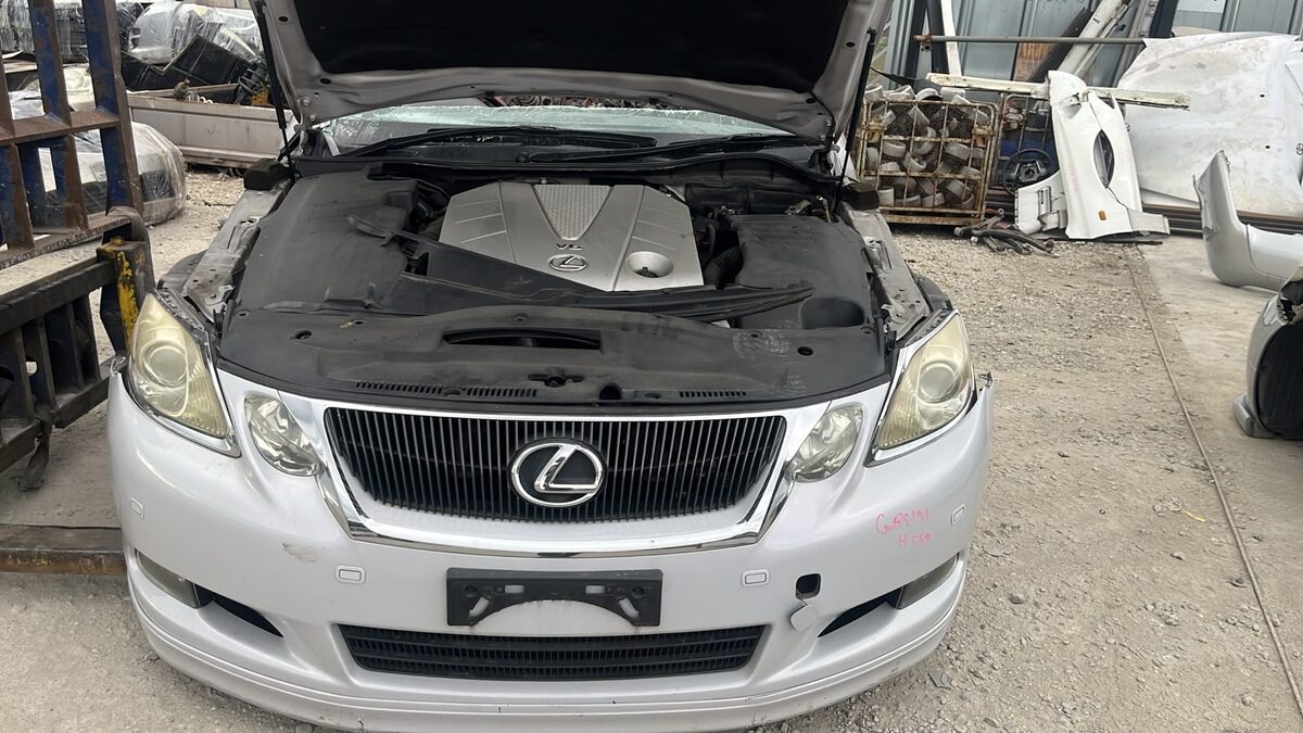 White Lexus car parked in a vehicle yard