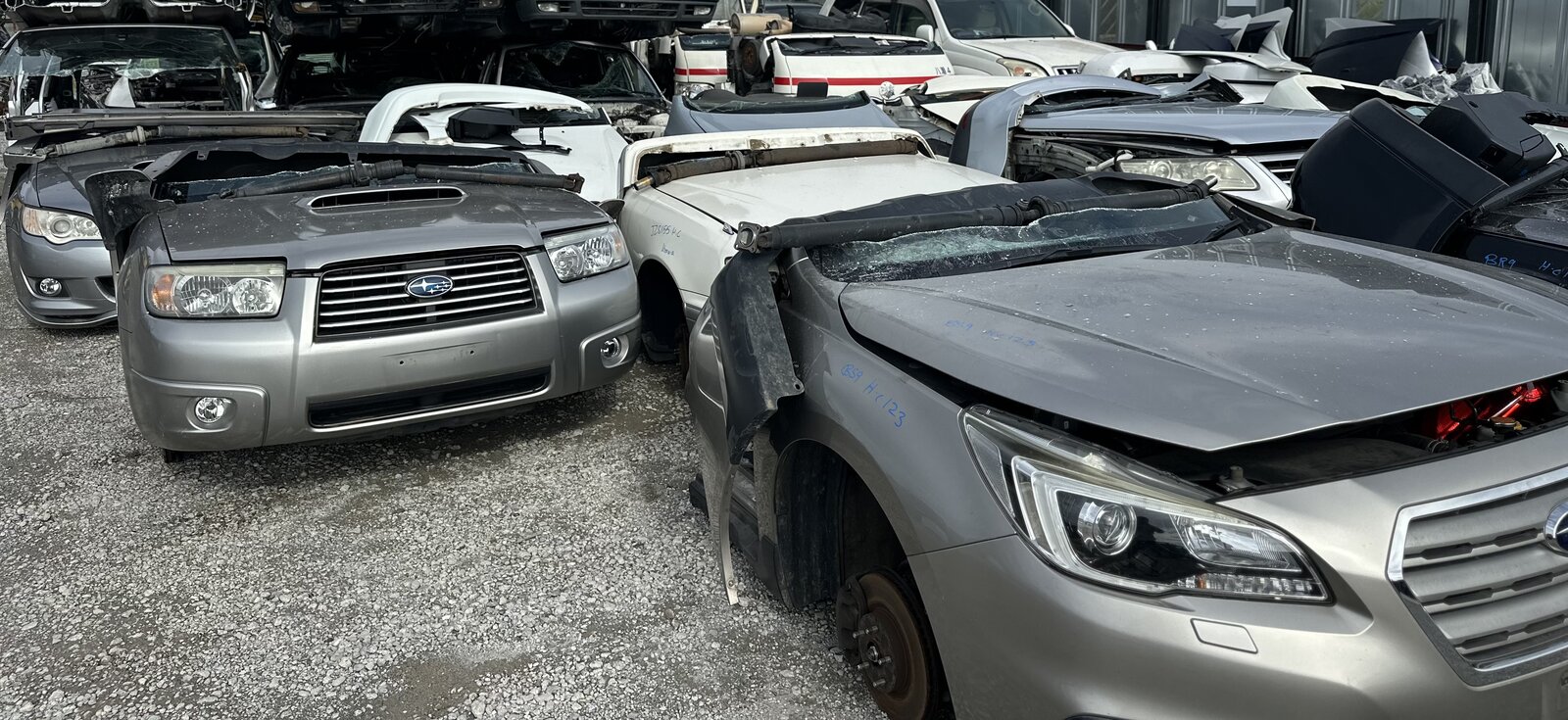 Vehicles and front body sections stored in the yard